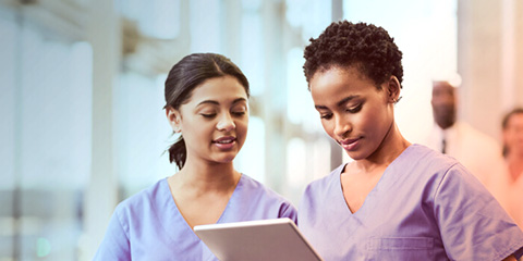two nurses reviewing data