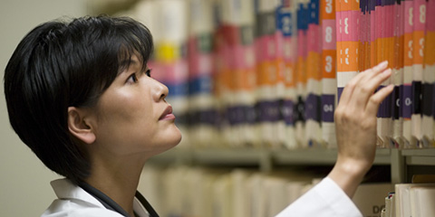 Nurse looking at patient records