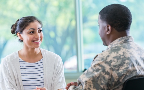 Active duty military member in a face-to-face meeting