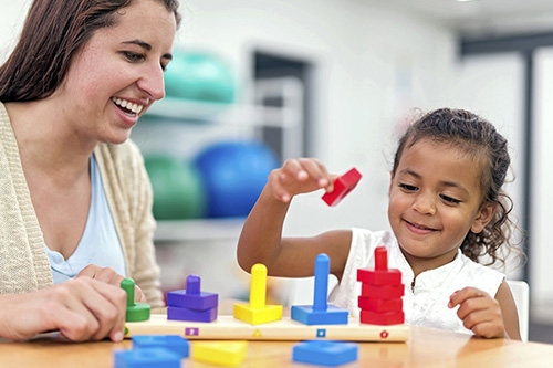 Adult playing with child