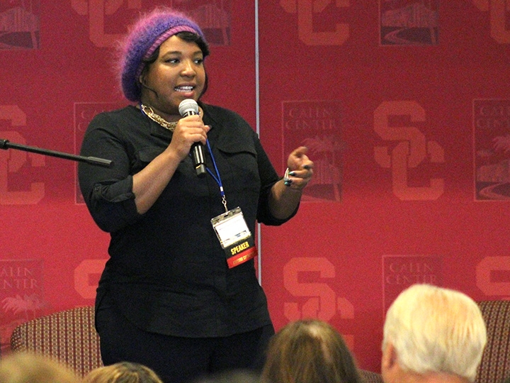 Woman with microphone giving a talk