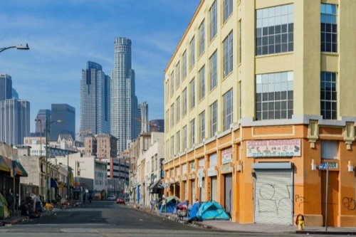 City street with tents on the sidewalk
