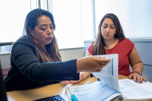 People looking at paperwork together.