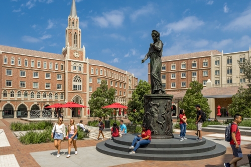 Campus photo with statue