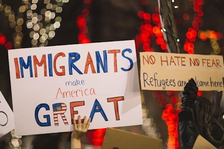 Immigrants make America great sign