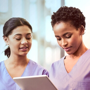 two nurses reviewing data