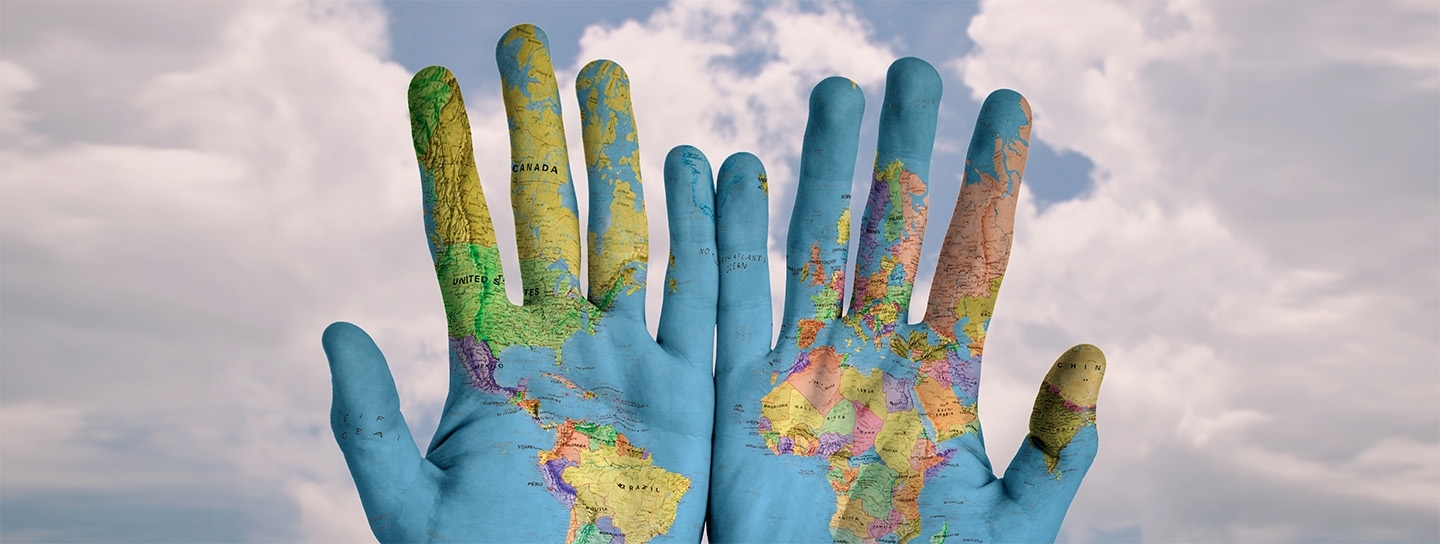 hands with world map